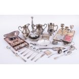 A collection of silver plated wares including tankards, flatware, caddy spoon, cased dessert knife