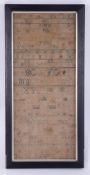 An 18th century needlework sampler depicting the alphabet and various symbols, dated 1785, 46cm x