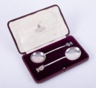 James Usher & Son, a pair of silver spoons with devil finials, approx weight 55.1g, cased.