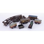 Tinplate O gauge and clockwork part train set and track.