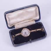 A vintage 9ct yellow gold hexagonal faced Bentima ladies wristwatch on a gold stretch bracelet