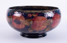 William Moorcroft, a large footed bowl of Pomegranate design, diameter 28cm.