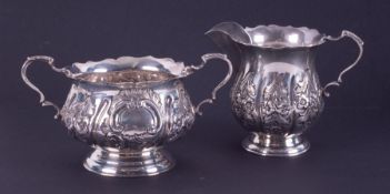 A silver sucre decorated with flowers, Birmingham hallmark, maker mark J.M.B. together with a