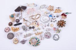 A mixed bag of costume jewellery to include earrings, bead necklaces, brooches, watch, etc.