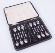 A cased set of 12 silver tea/coffee spoons and two sugar tongs, Sheffield, approx 3.93oz.