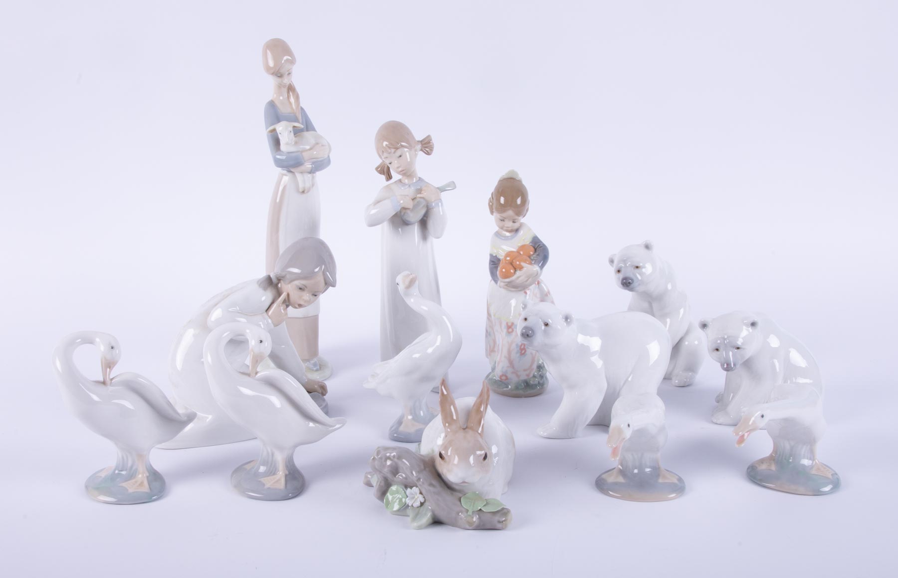 A collection of Lladro figurines including polar bear, ducks, rabbit etc (13).