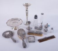A collection of silver backed dressing table wares, also a silver vase with anniversary