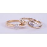 An 18ct yellow gold ring set with 0.25 carats of round brilliant cut diamond, 2.45gm, size L and a