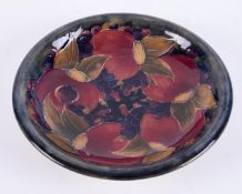 William Moorcroft, a Pomegranate shallow dish, diameter 22cm.