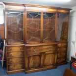 A large reproduction mahogany two section bookcase, glazed upper section, fitted with a fall front