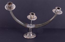 An unusual Eastern white metal (silver?) and horn two branch candelabra, height 26cm.