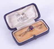 An antique 9ct yellow bar brooch with amethyst and seed pearls, boxed.