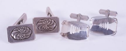 A pair of rectangular silver cufflinks with a central flower pattern, stamped 925, Denmark, GJ (