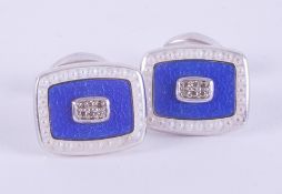 A pair of silver rectangular shaped cufflinks with blue & white enamels and each set with six