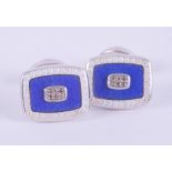 A pair of silver rectangular shaped cufflinks with blue & white enamels and each set with six