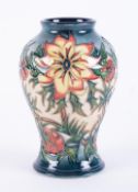 Moorcroft, a baluster Spike vase, signed by Wendy Mason, height 17cm, boxed.