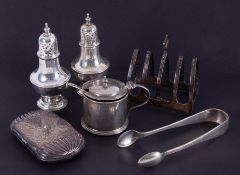 Various silver objects including a four division toast rack, embossed and engraved cigarette case,