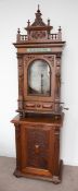 A German Kalliope coin operated Polyphon music player, overall dimensions: 212cm x 63.5cm x 46cm,