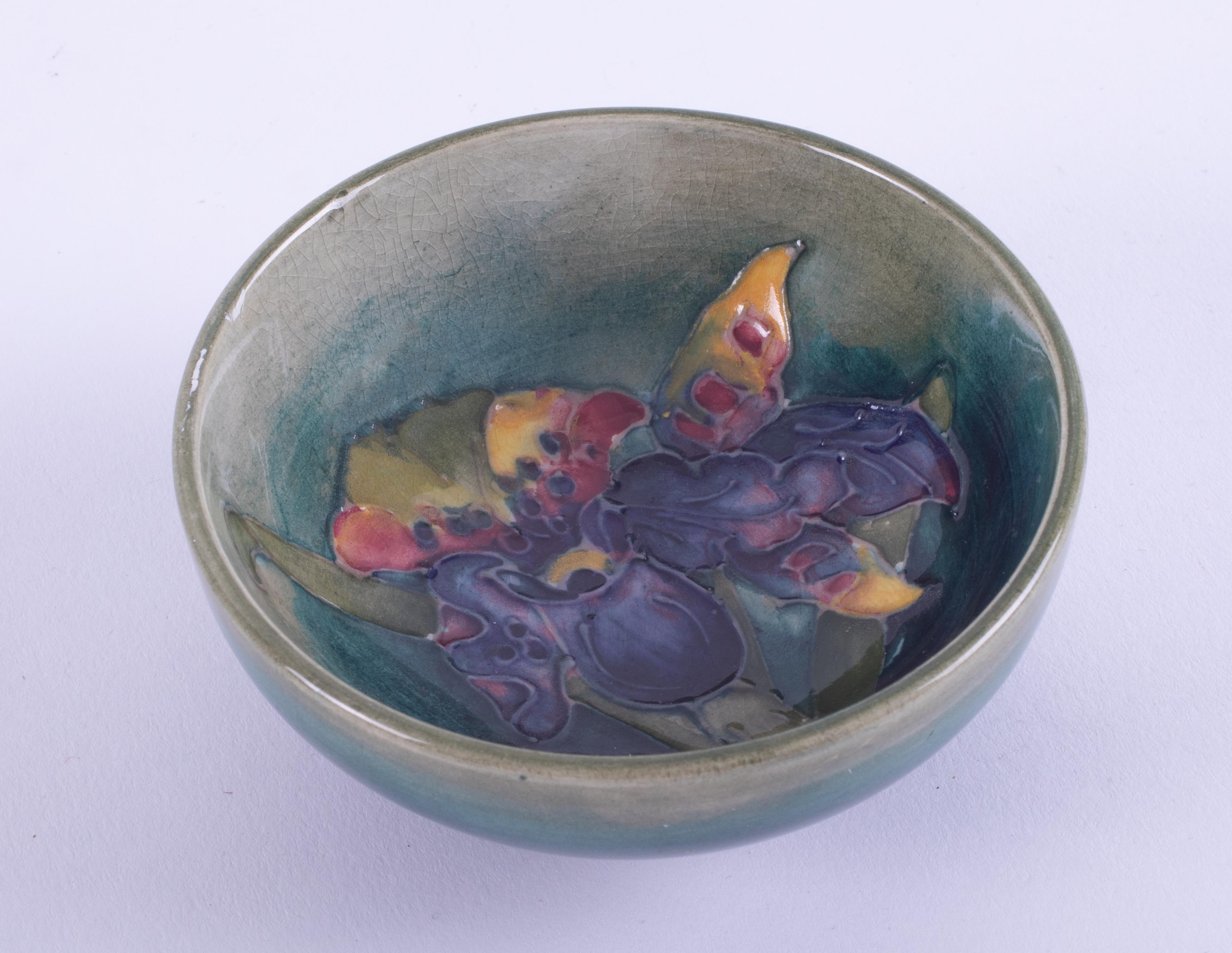 William Moorcroft, a small flower patterned pin bowl, 8cm diameter.