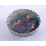 William Moorcroft, a small flower patterned pin bowl, 8cm diameter.