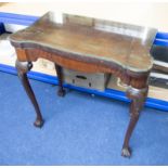 A mahogany fold over card table on cabriole legs with claw & ball feet, 76cm wide, glass top.