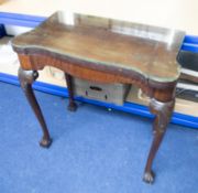 A mahogany fold over card table on cabriole legs with claw & ball feet, 76cm wide, glass top.