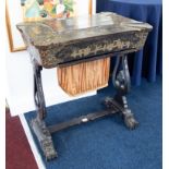 A 19th century Chinese lacquered work table with fitted interior to include various carved bone