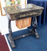 A 19th century Chinese lacquered work table with fitted interior to include various carved bone