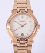 Gucci, a ladies gold plated stainless steel wristwatch with date window, quartz, backplate stamped