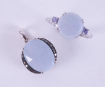 Two items of jewellery to include a 9ct white gold ring set with a faceted round cut Jacui blue fire