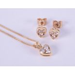 A matching set of jewellery to include an 18ct yellow gold heart shaped pendant set with three round