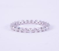 A 14ct white gold full eternity ring set with 0.90 carats of round brilliant cut diamonds, colour