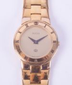 Gucci, a ladies yellow gold plated wristwatch, model 3300L, quartz movement, spare links.