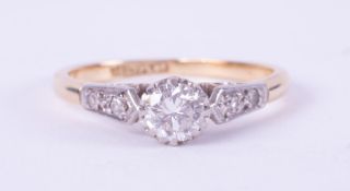 An 18ct yellow gold & platinum ring set with a central round brilliant cut diamond, approx. 0.36