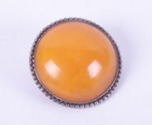 A silver (stamped 800) circular design brooch set with amber, pin & catch fastening, diameter