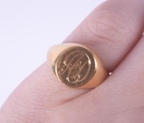 An 18ct yellow gold oval signet ring, table engraved AD, 8.56gm, size J.