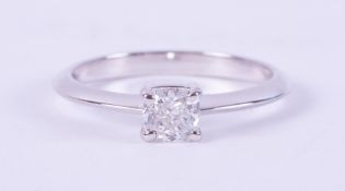 A 14ct white gold ring set with a 0.50 carat cushion cut diamond, colour F, VS2 clarity,