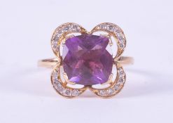 An 18ct yellow gold flower design ring set with a fancy mixed square cut amethyst, approx. 5.00