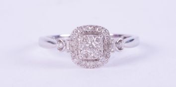 A 9ct white gold square design cluster ring set with small round brilliant cut diamonds, total