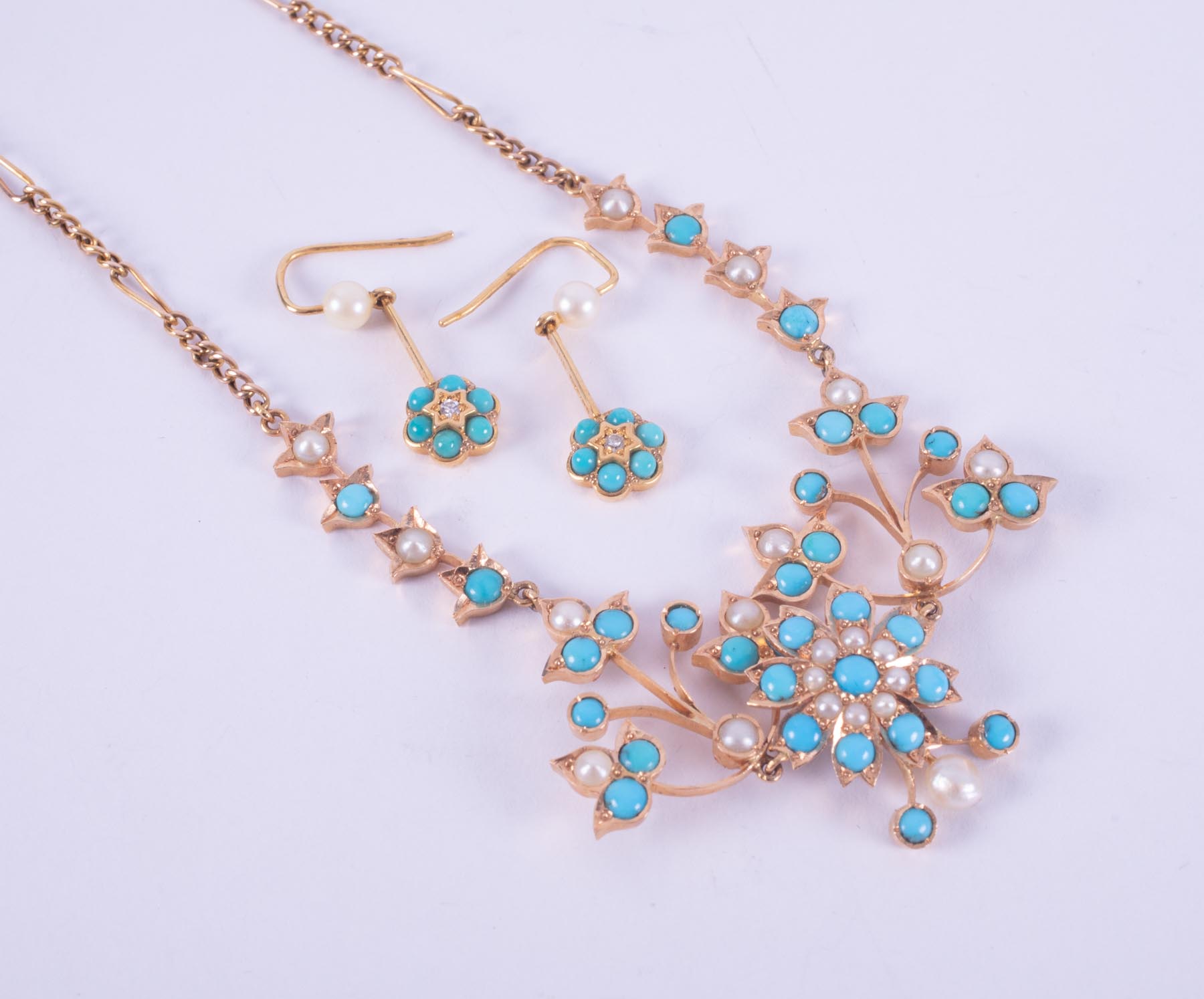 An antique 9ct yellow gold (not hallmarked or tested) necklace of flower design set with round
