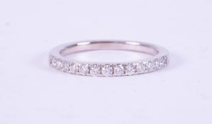 An 18ct white gold half eternity ring set with approx. 0.26 carats of round brilliant cut