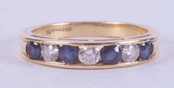 An 18ct yellow gold half eternity ring set with four round cut sapphires, approx. total weight 0.