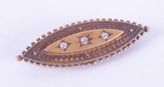 A Victorian 15ct yellow gold mourning brooch decorated with flower & leaf engraving and set with