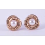 A pair of 9ct yellow gold swirl design stud earrings set with a 5mm cultured pearl, post & butterfly