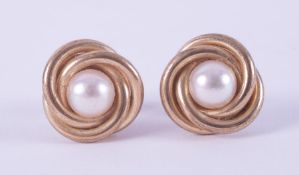 A pair of 9ct yellow gold swirl design stud earrings set with a 5mm cultured pearl, post & butterfly
