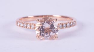 An 18ct rose gold ring set with a central round cut pink morganite, approx. 2.00 carats with six