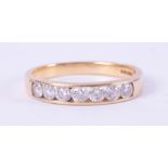 An 18ct yellow gold half eternity ring set with round brilliant cut diamonds, total diamond weight