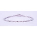An 18ct white gold line bracelet set with approx. 3.00 carats total weight of round brilliant cut