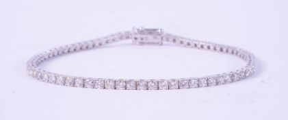 An 18ct white gold line bracelet set with approx. 3.00 carats total weight of round brilliant cut