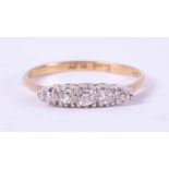 An 18ct yellow gold & platinum five stone diamond ring, set with approx. 0.15 carats total weight of